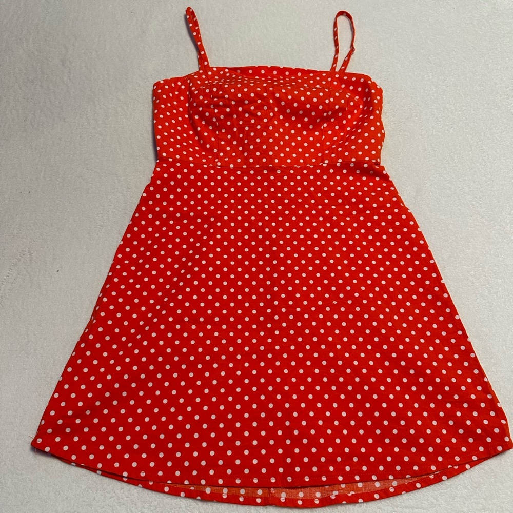 Orange and white polka dot mini dress